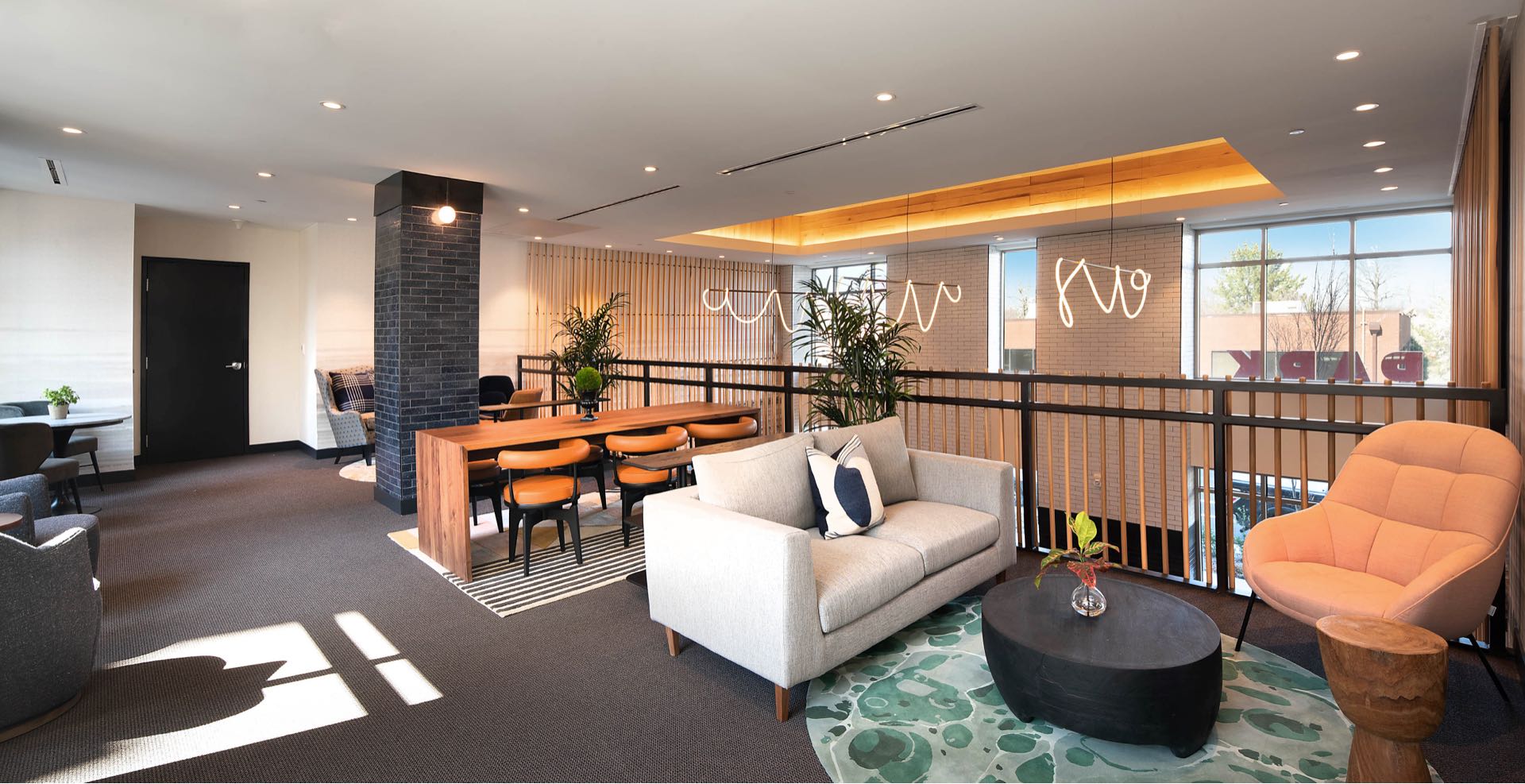 Faraday Park East upper level lounge with comfortable seating and modern design features